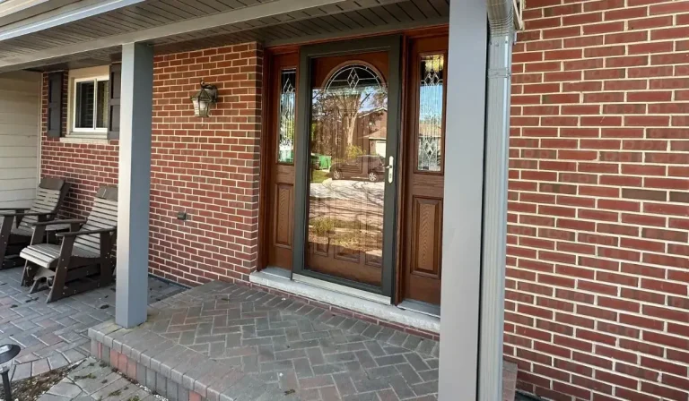 New custom woodgrain entry door with decorative glass installed on a red brick home in Hinsdale IL.