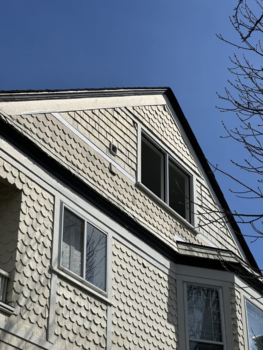 Historic home with scalloped shake siding and newly replaced windows