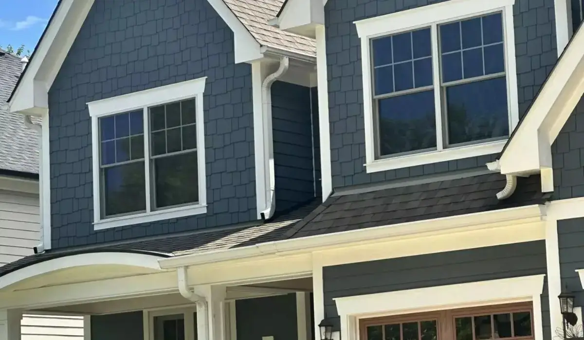 Blue James Hardie fiber cement shingle siding on a historic-style Hinsdale home.