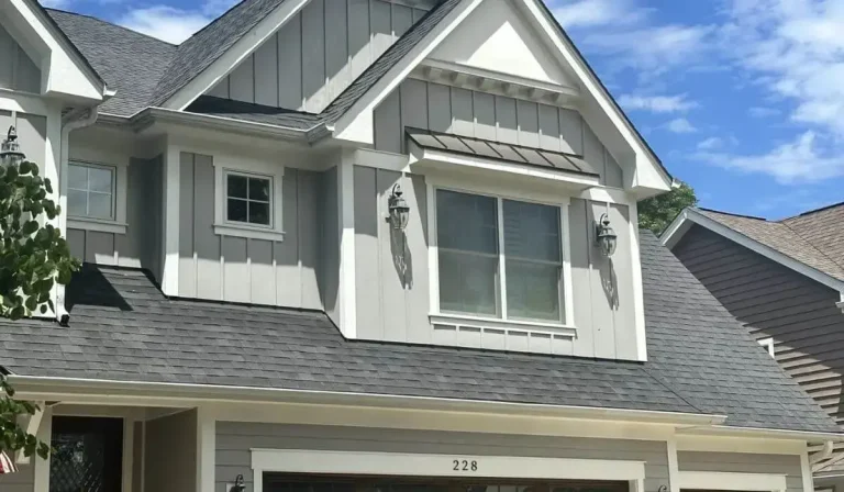 Modern Hinsdale home featuring light gray James Hardie siding installation.