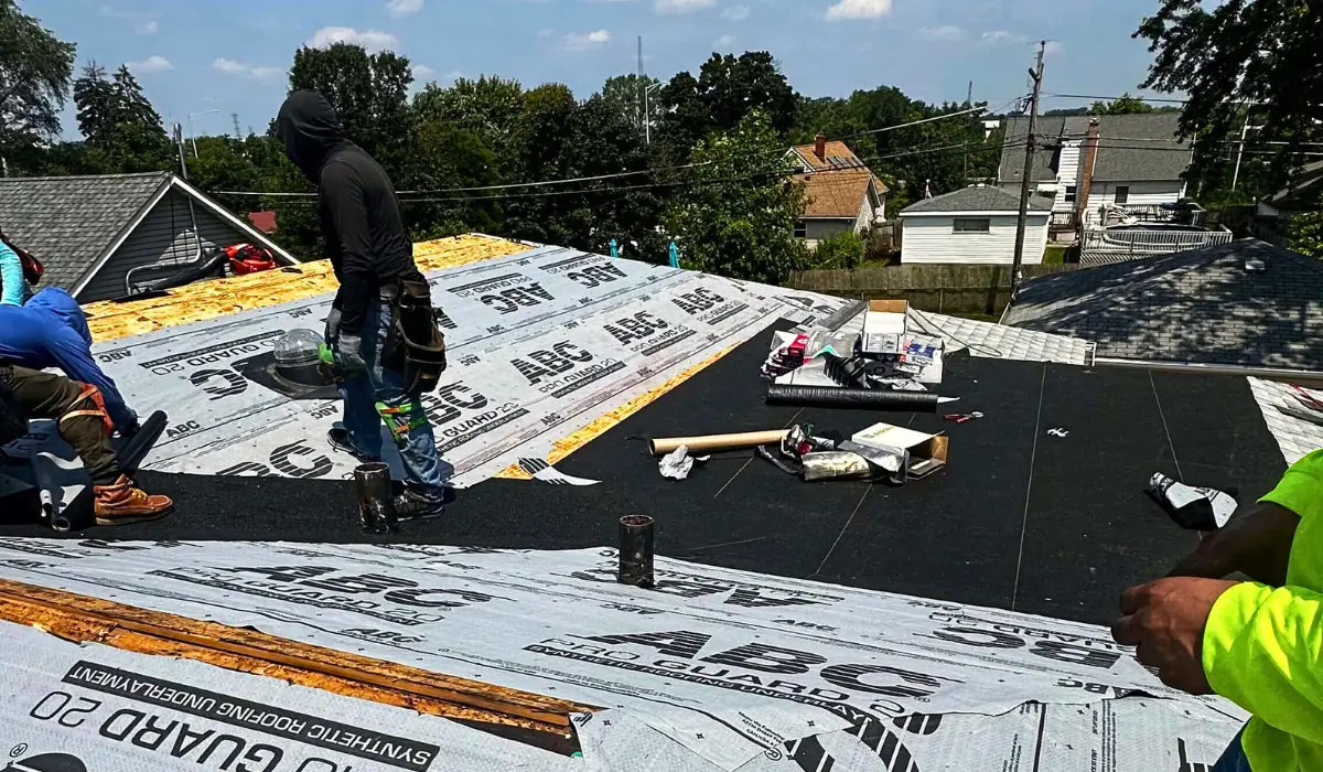 A professional team from the best roofing company Downers Grove installs high-quality shingles on a residential roof, ensuring a durable and safe repair.