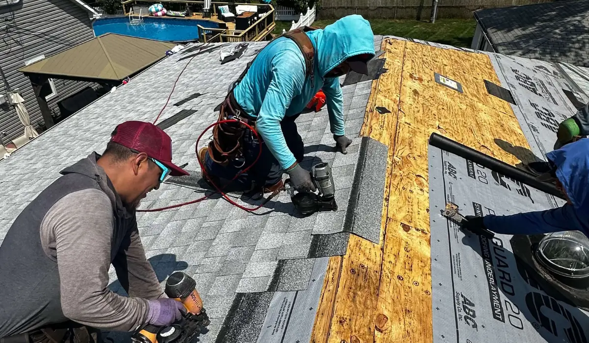 Roofers installing shingles during a Roof Replacement Timeline in Downers Grove, part of a professional roof replacement process.
