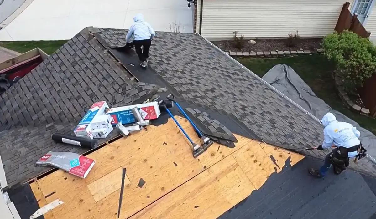 Roofers from Royal Craft Home Remodelers install new shingles over roof decking during a repair or replace roofing project.