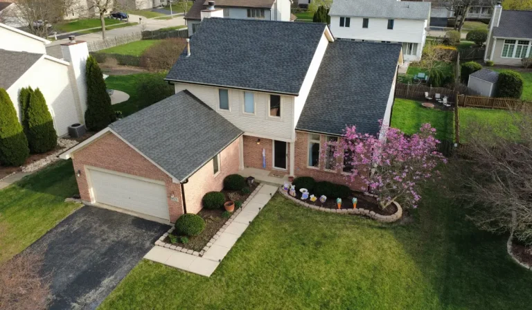 Clean aerial image of a new roof — a common example of homes that may unknowingly face issues due to limited roof warranties.