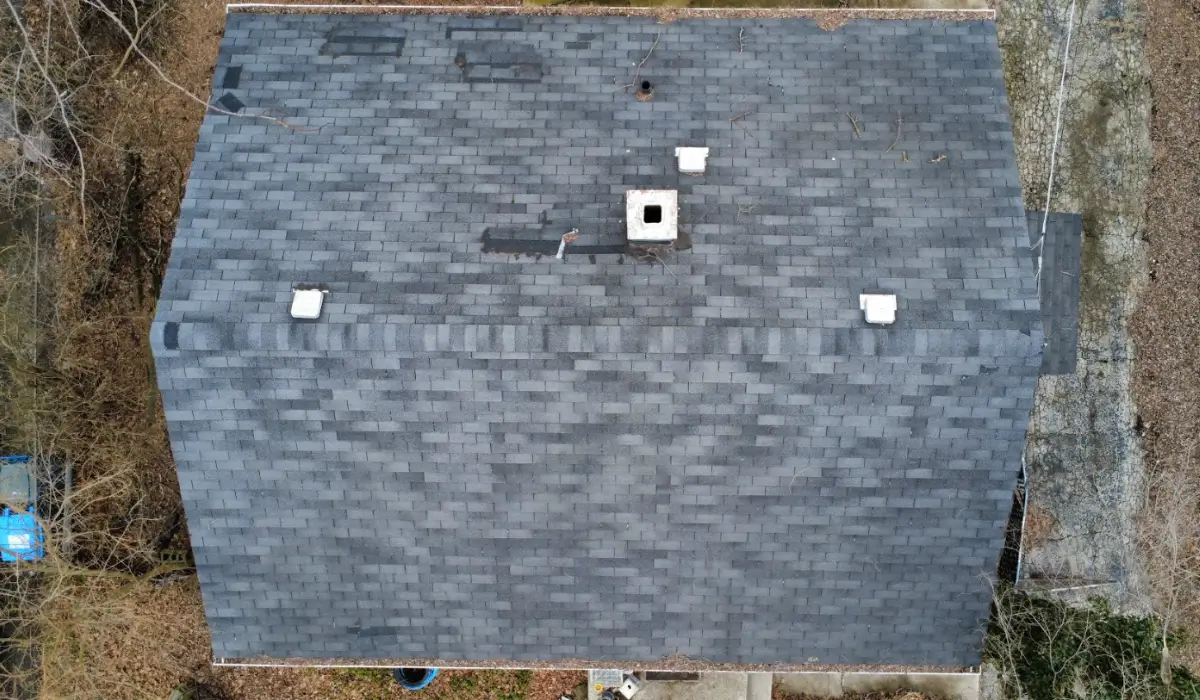 Aerial view of aging roof showing signs that the roof needs replacement before harsh winter weather arrives.